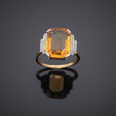 an orange sapphire and diamond ring