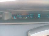 a digital clock on the dashboard of a car