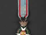 a close up of a medal on a black surface