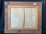 an old picture frame with a picture of a window in it