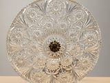 a glass plate that has a flower design on it