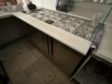 a kitchen with a stove and a sink in it