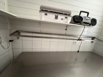 an image of a commercial kitchen with stainless steel counter tops