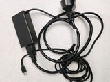 a black power cord that is connected to a charger