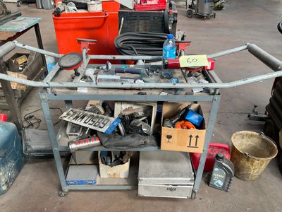 a workbench with a lot of tools on top of it