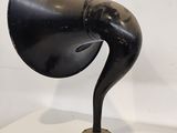 a black lamp that is on top of a table