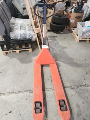 a fork lifter that is sitting in a warehouse