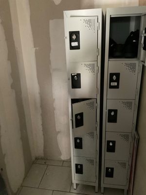 two lockers in the corner of a room that is being remodeled