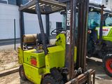 two forklifts that are parked next to each other