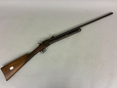 a rifle with a wooden handle and a wooden barrel