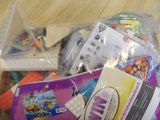 a plastic bag full of toys on the floor