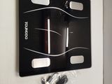 a picture of a bathroom scale hanging on the wall
