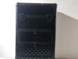 an image of a black suitcase with wheels on a white surface