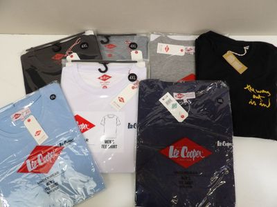 several t - shirts are sitting on a table with a price tag