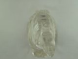 a clear glass elephant figurine sitting on a white surface