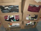 three boxes with clothes in them sitting on the floor