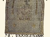 an image of a woven purse hanging on a chain