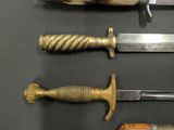 several different types of knifes and knives on a table