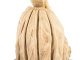 statue of a woman in a dress and hat sitting on a base