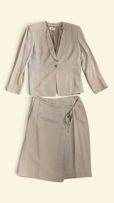 a picture of a woman ' s suit and skirt on a white background