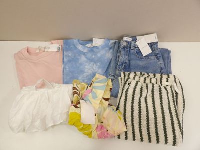 a lot of clothes that are on a table