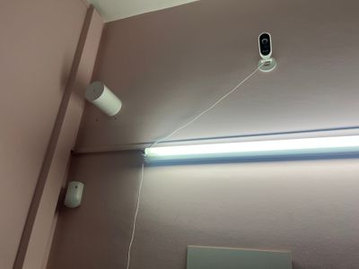 an image of a bathroom with a camera on the wall