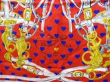 a picture of a red and blue scarf with gold and blue hearts