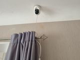 a picture of a camera mounted to the ceiling of a room