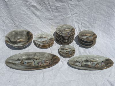 a lot of plates that are sitting on a table