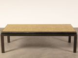 a coffee table with a wooden top and black legs