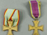 two medals of the order of merit and the order of the cross