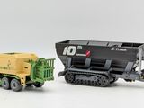 two toy vehicles that are next to each other on a white surface