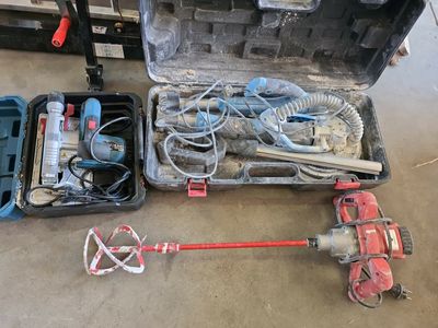 a tool box with tools in it sitting on the floor