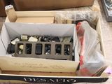 a box full of assorted electronic devices on the floor