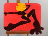a painting on a easel with a painting of a woman on it