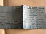a passport that is sitting on top of a piece of paper