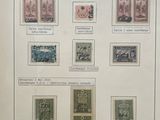 a picture of a collection of stamps on display in a glass case