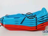 several blue and red kayaks stacked on top of each other