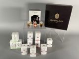 a display of perfume bottles and boxes on a table