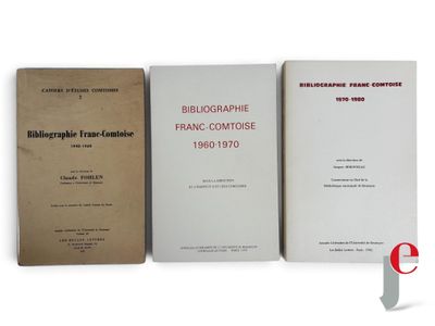 three books are sitting on a white surface next to each other