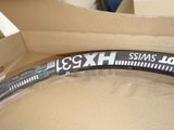 a bike tire in a box with a sticker on it