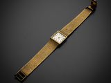 une montre-bracelet en or 18 carats avec un cadran blanc