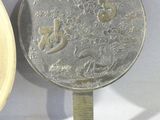 a small mirror and a small mirror on a white surface