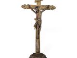 an old wooden crucif with a cross on top of it