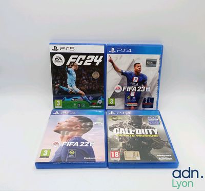 two video games are sitting on a white surface with a white background