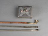 an image of a metal pipe and a wooden stick on a table