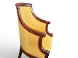 an image of a yellow and brown chair on a white background