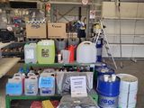 a lot of containers and containers on a table in a garage