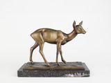 statue of a deer on a marble base on a white background
