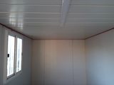 a picture of a room with a white ceiling and a window